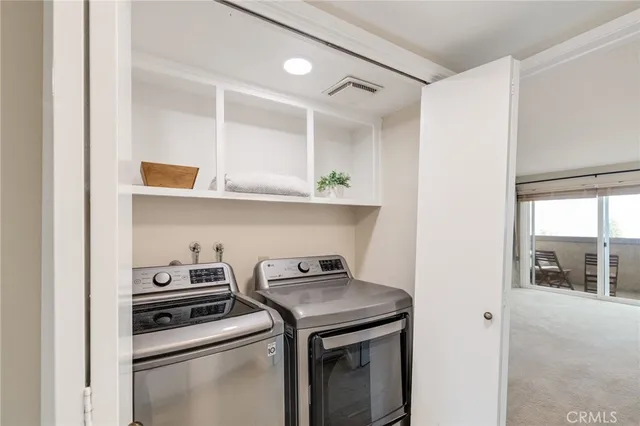a bathroom with a granite countertop sink toilet a shower and a mirror