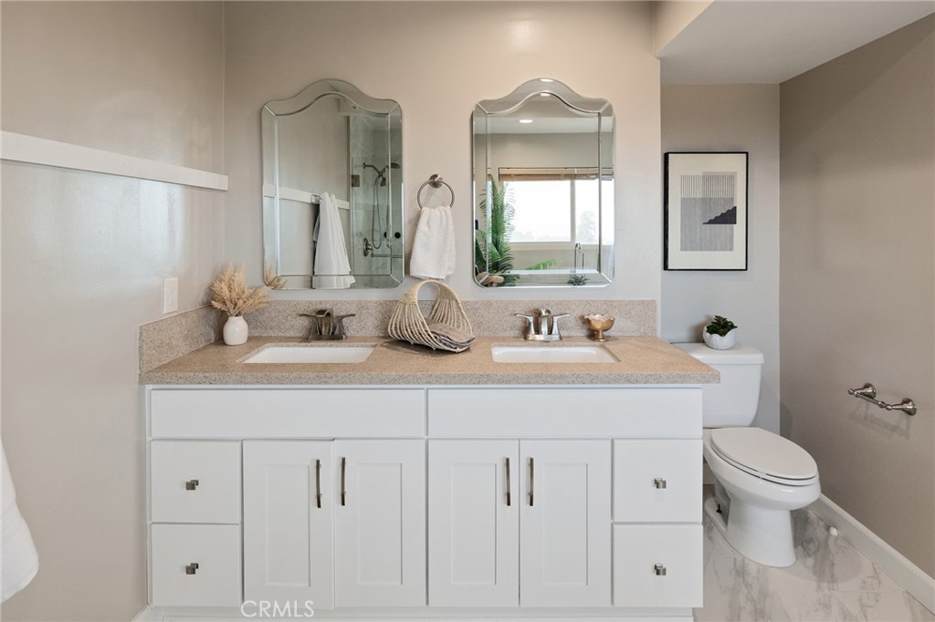 58 Hilltop Circle Rancho Palos Verdes, CA 90275 - Photo 36 of 51 a bathroom with a sink a toilet and mirror