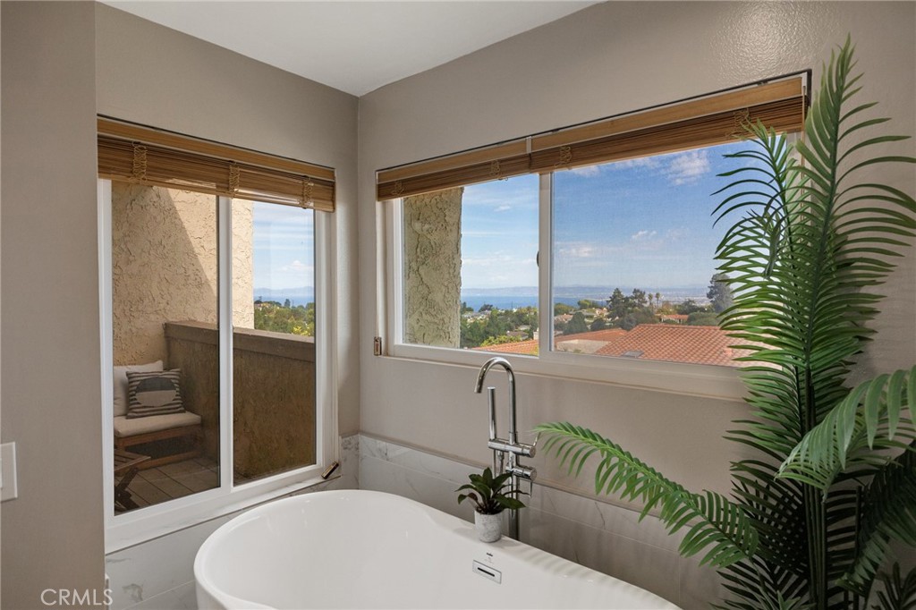 58 Hilltop Circle Rancho Palos Verdes, CA 90275 - Photo 38 of 51 a bathroom with a granite countertop sink and a large mirror