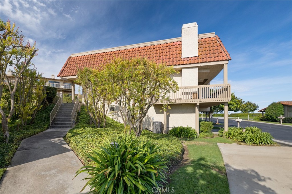 58 Hilltop Circle Rancho Palos Verdes, CA 90275 - Photo 9 of 51 a front view of a house with a yard