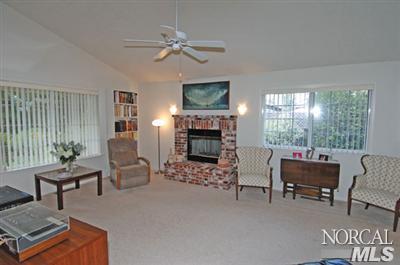 2152 Waltzer Road Santa Rosa, CA 95403 - Photo 2 of 9 a living room with furniture and a fireplace
