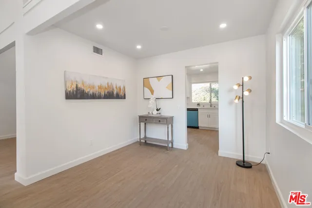 a view of a room with furniture and window