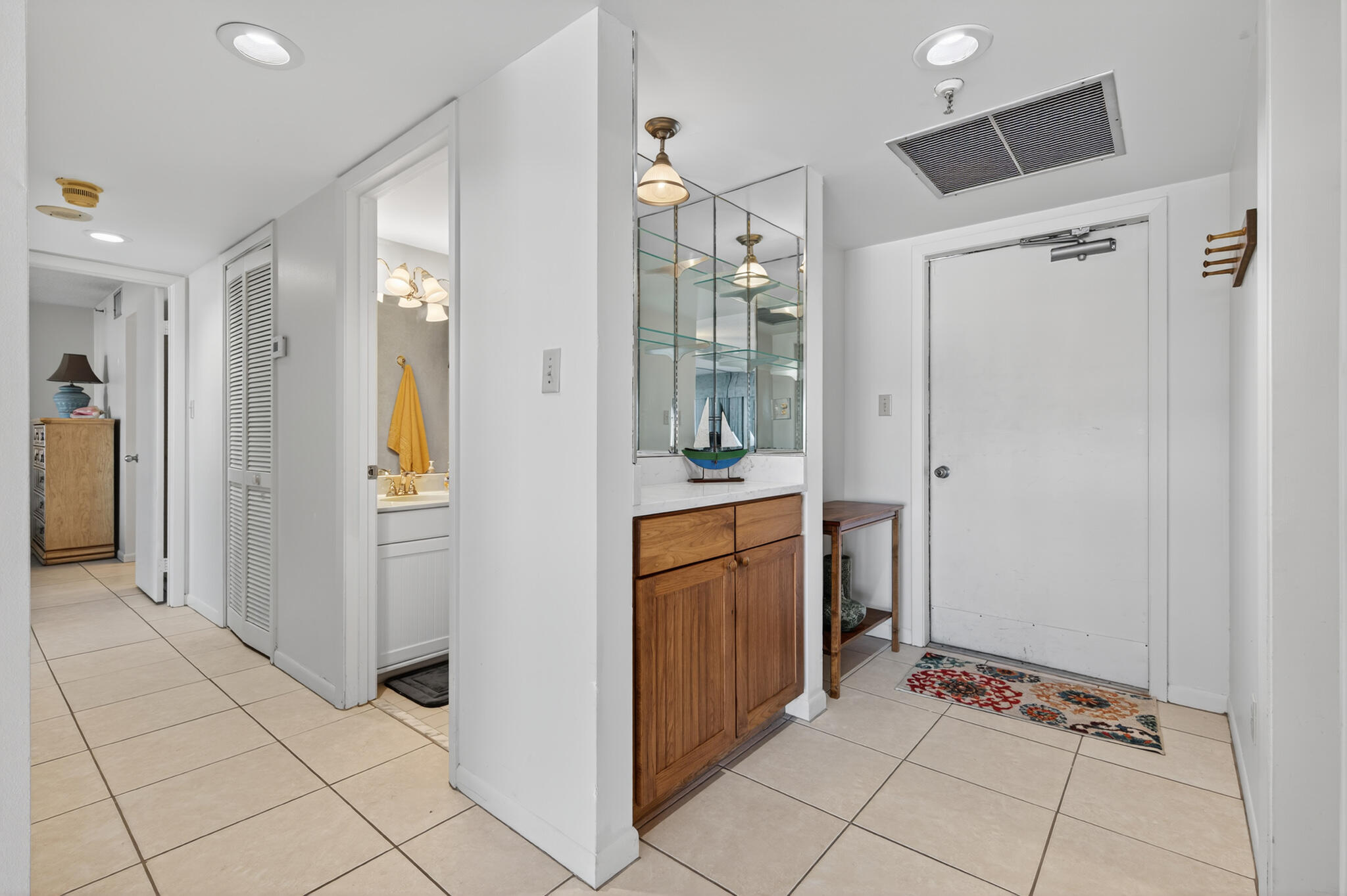 801 South Ocean Drive, Unit 404 Fort Pierce, FL 34949 - Photo 11 of 37 a view of a hallway and an dining rom with furniture
