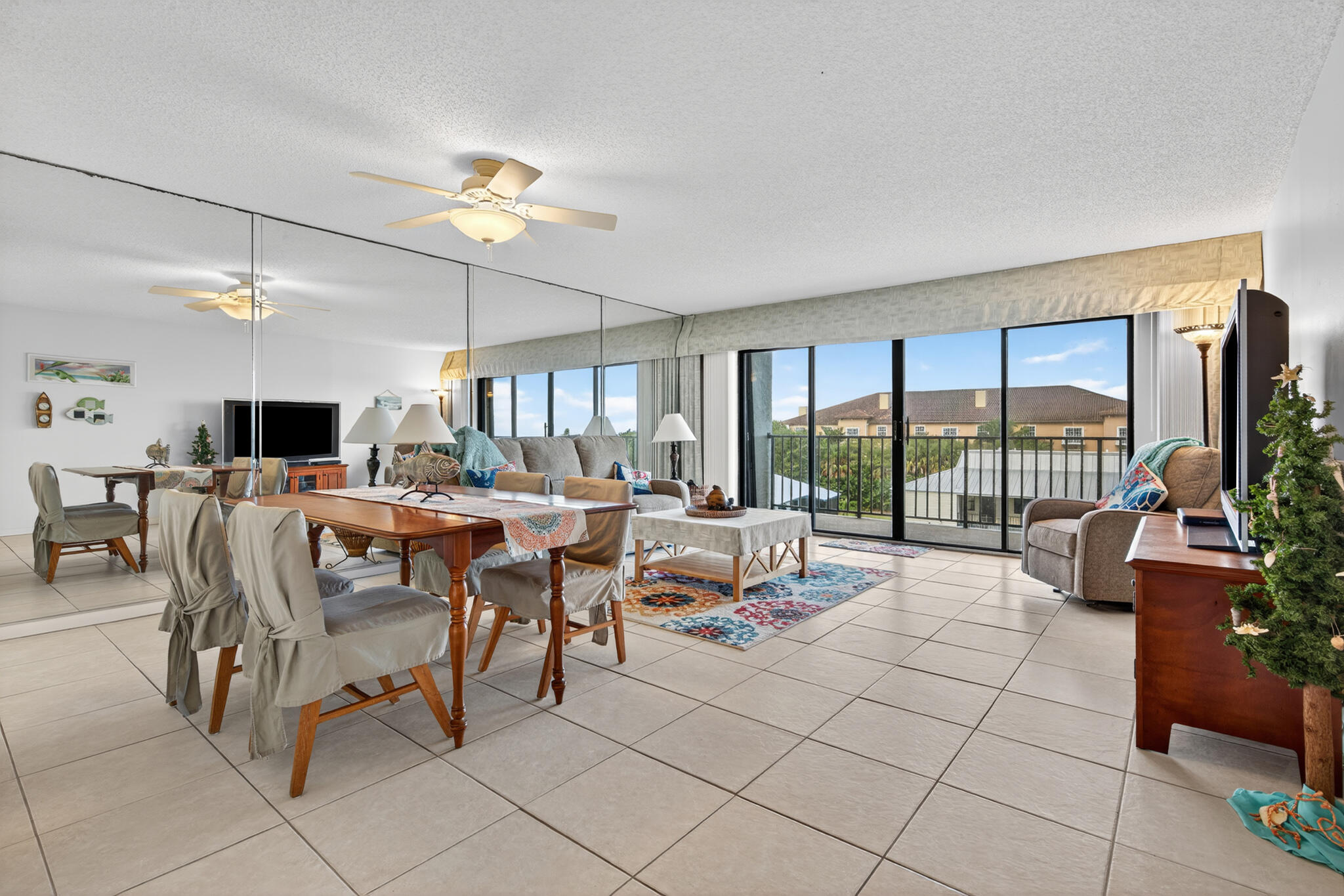 801 South Ocean Drive, Unit 404 Fort Pierce, FL 34949 - Photo 12 of 37 a living room with lots of furniture and a large window