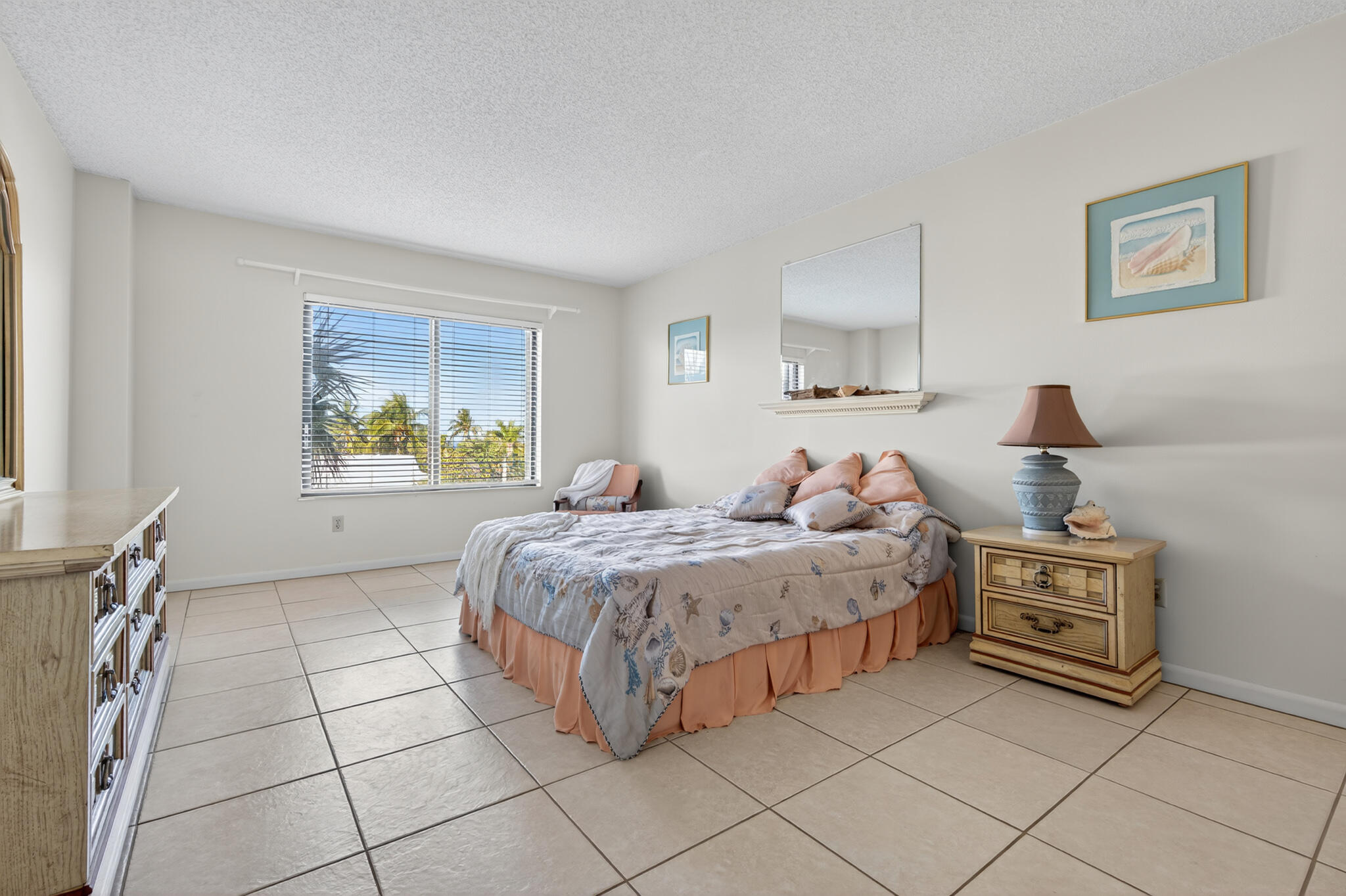 801 South Ocean Drive, Unit 404 Fort Pierce, FL 34949 - Photo 21 of 37 a bedroom with a bed and a cabinets