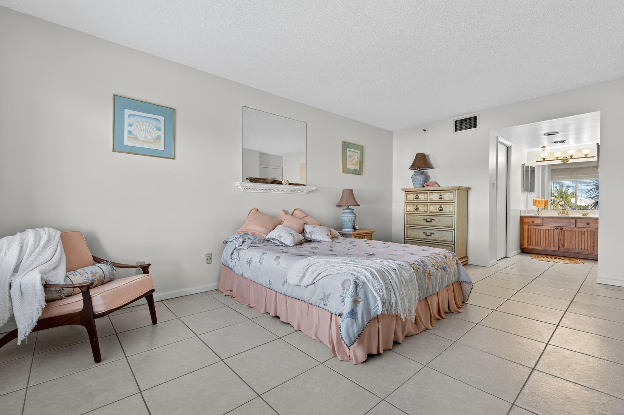 801 South Ocean Drive, Unit 404 Fort Pierce, FL 34949 - Photo 22 of 37 a bedroom with a bed and a view of kitchen