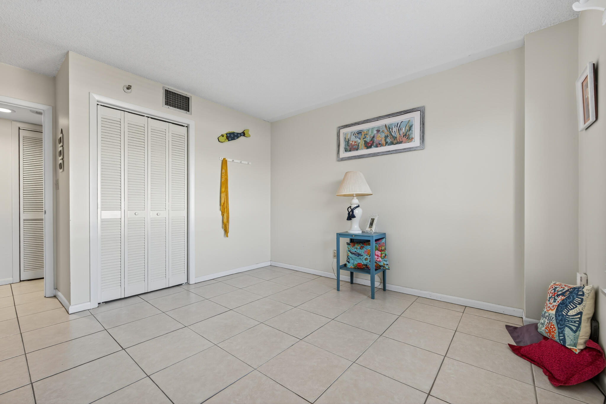801 South Ocean Drive, Unit 404 Fort Pierce, FL 34949 - Photo 27 of 37 a view of a hallway with closet and toys