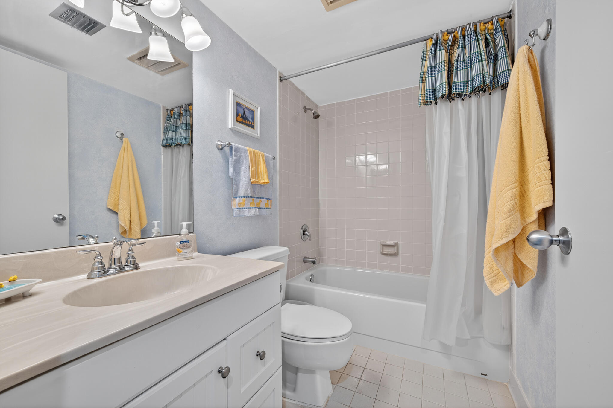 801 South Ocean Drive, Unit 404 Fort Pierce, FL 34949 - Photo 28 of 37 a bathroom with a granite countertop sink a toilet and shower