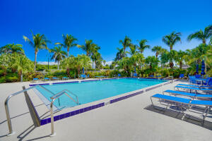 801 South Ocean Drive, Unit 404 Fort Pierce, FL 34949 - Photo 33 of 37 a view of swimming pool with outdoor seating and yard