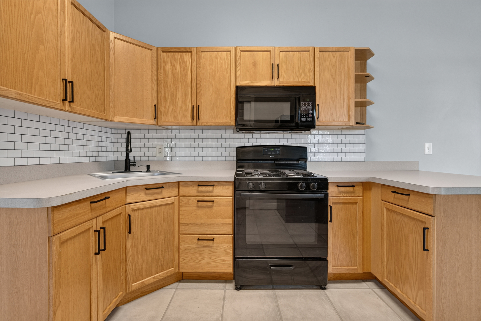 1128 Butler Street Morris, IL 60450 - Photo 13 of 28 a kitchen with stainless steel appliances granite countertop white cabinets and a sink