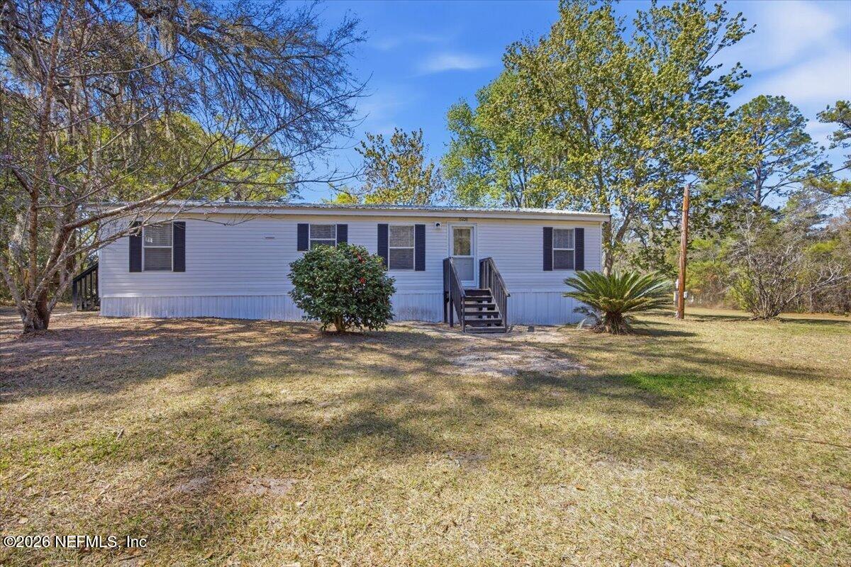 5621 Willow Road Macclenny, FL 32063 - Photo 15 of 15 front view of house with a yard