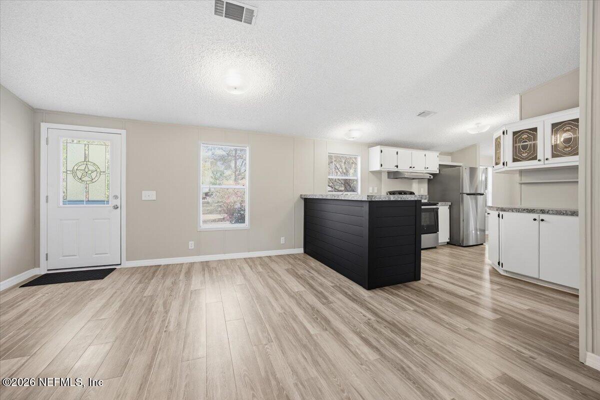 5621 Willow Road Macclenny, FL 32063 - Photo 3 of 15 a view of kitchen with wooden floor