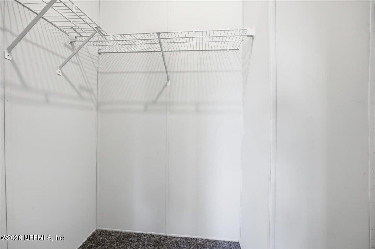 5621 Willow Road Macclenny, FL 32063 - Photo 10 of 15 a view of a room with racks on the wall
