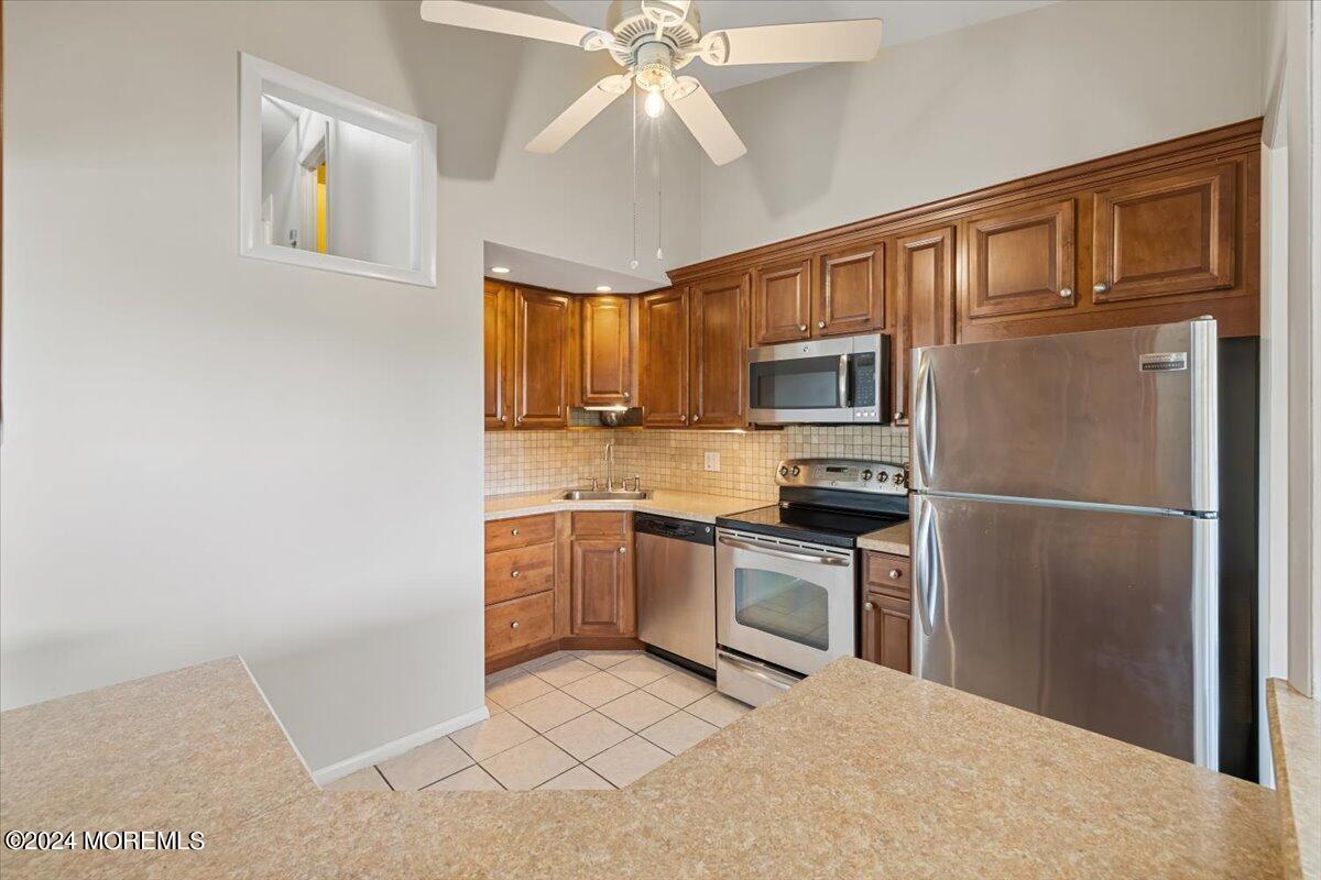 58 Overlook Drive Clinton, NJ 08809 - Photo 11 of 24 a kitchen with a refrigerator stove and microwave