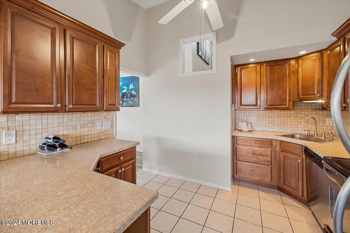 58 Overlook Drive Clinton, NJ 08809 - Photo 12 of 24 a kitchen with stainless steel appliances a sink stove and cabinets