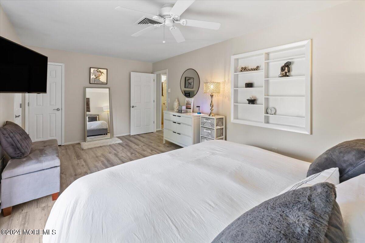 58 Overlook Drive Clinton, NJ 08809 - Photo 15 of 24 a bedroom with a large bed and flat tv