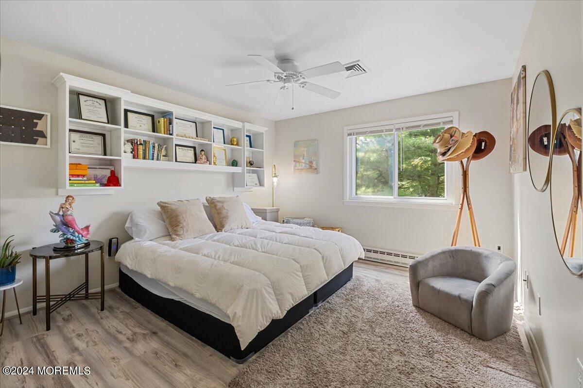 58 Overlook Drive Clinton, NJ 08809 - Photo 20 of 24 a bedroom with a bed and a window