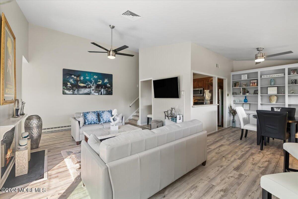 58 Overlook Drive Clinton, NJ 08809 - Photo 4 of 24 a living room with furniture and a flat screen tv