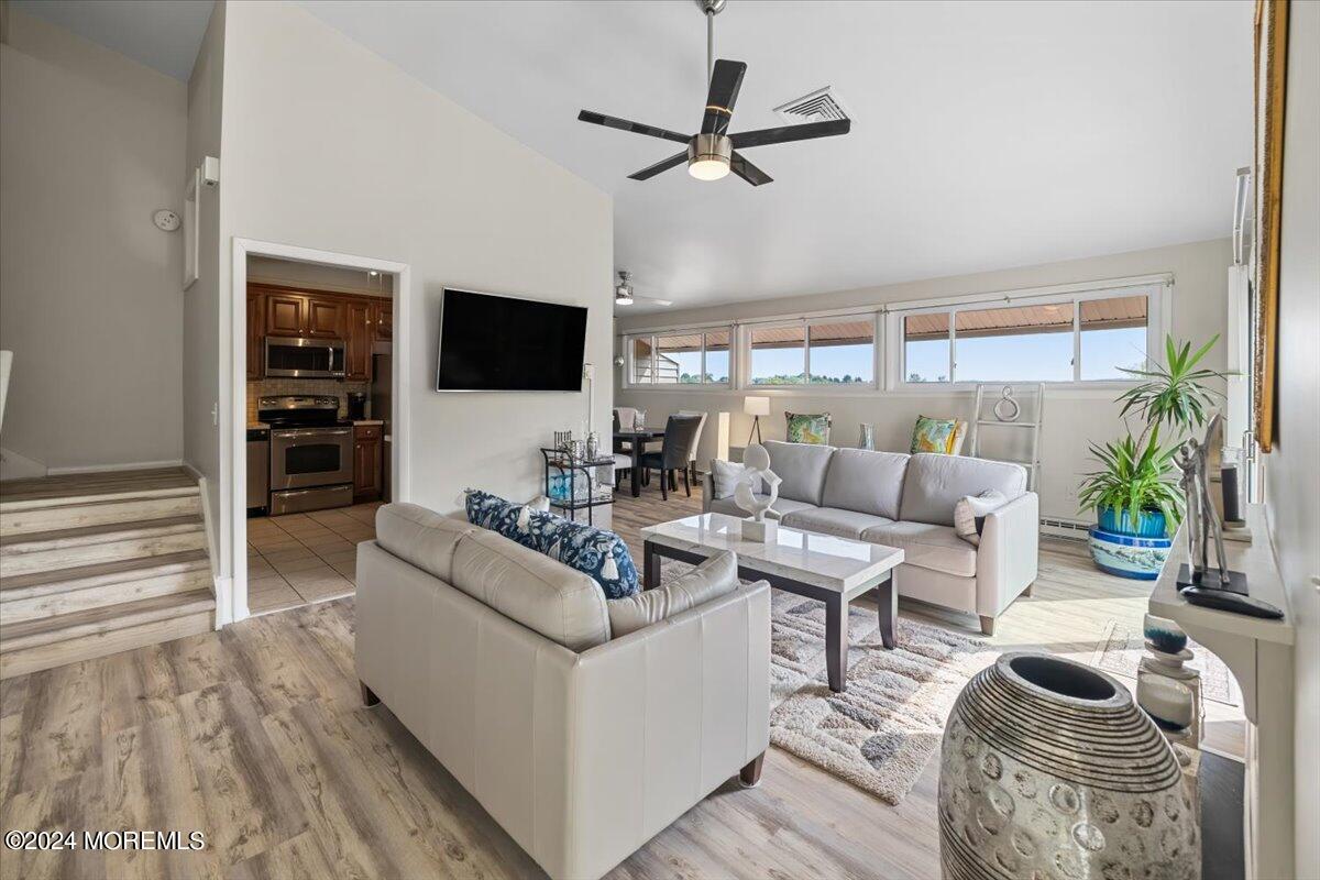 58 Overlook Drive Clinton, NJ 08809 - Photo 5 of 24 a living room with furniture ceiling fan and a flat screen tv