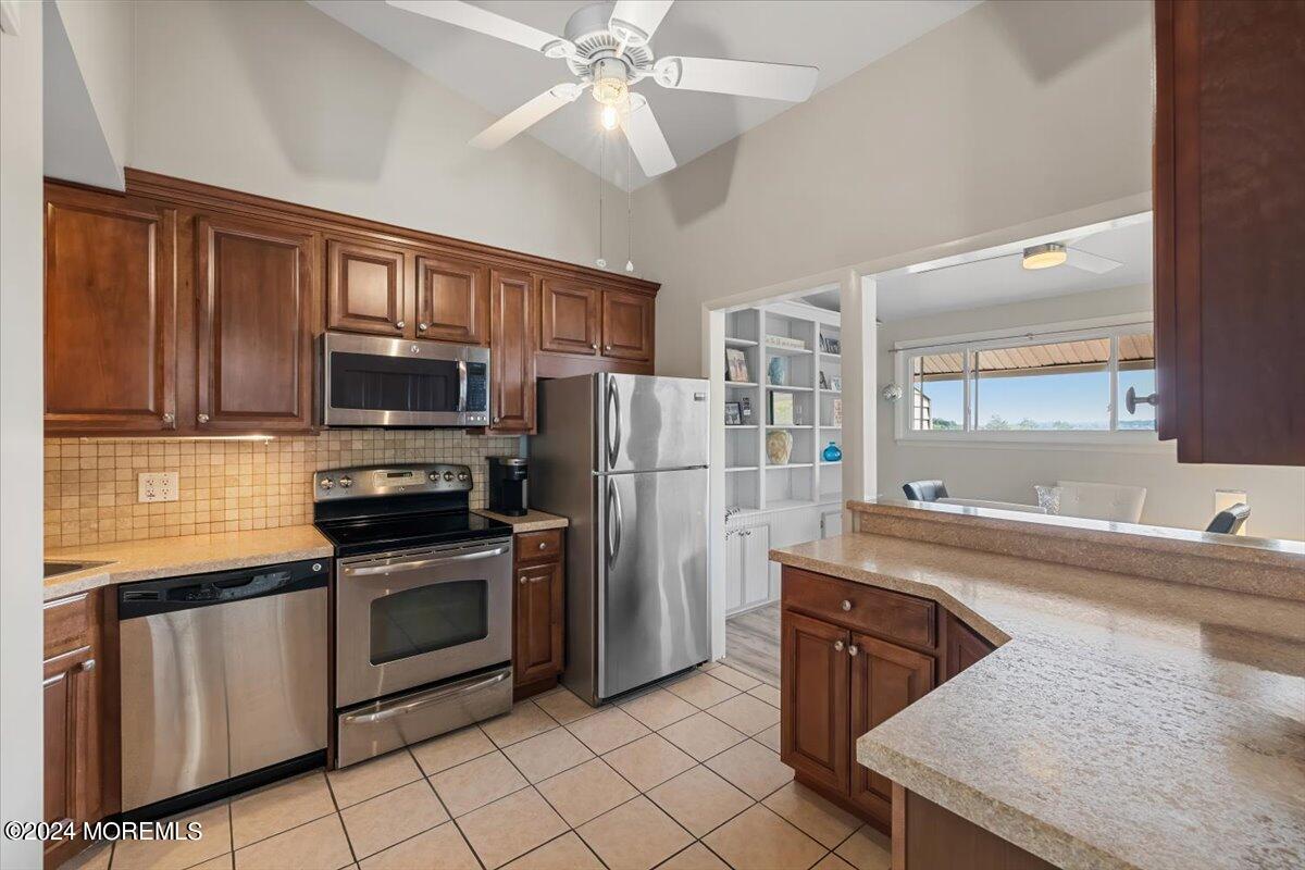 58 Overlook Drive Clinton, NJ 08809 - Photo 10 of 24 a kitchen with stainless steel appliances granite countertop a sink stove and refrigerator