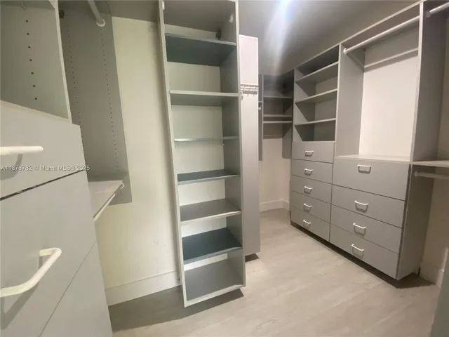 a view of an empty walk in closet