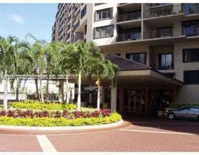 540 Brickell Key Drive, Unit 302 Miami, FL 33131 - Photo 22 of 24 a front view of a building with a garden