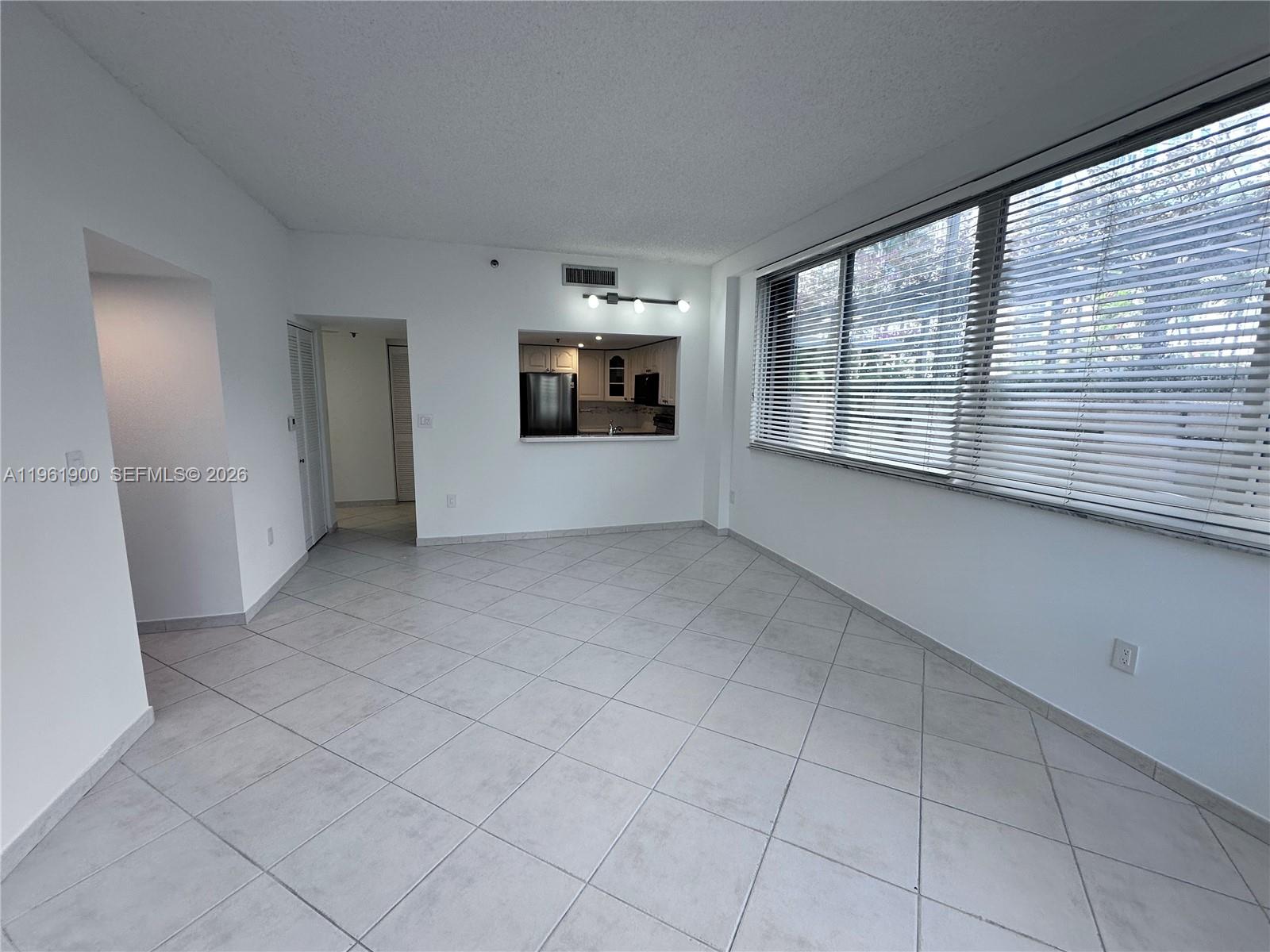540 Brickell Key Drive, Unit 302 Miami, FL 33131 - Photo 7 of 24 a view of an empty room with a window