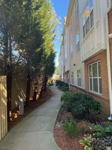 a view of a building with a yard