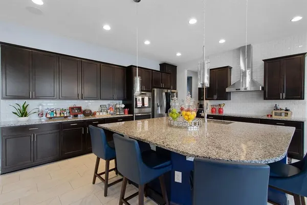 a kitchen with refrigerator and window