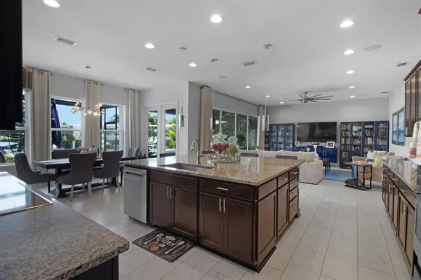 a bathroom with a granite countertop shower and a sink