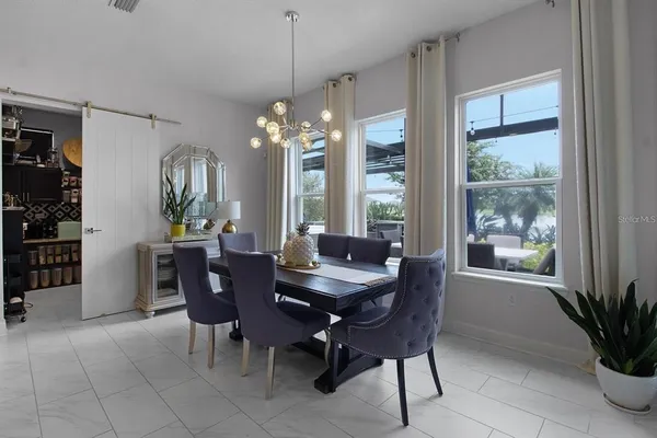 a bathroom with a granite countertop sink and a toilet