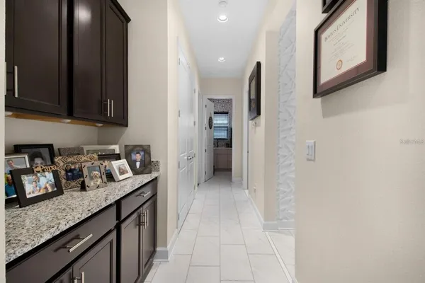 a view of staircase with railing and a window