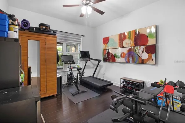 a view of a livingroom with furniture and hardwood floor