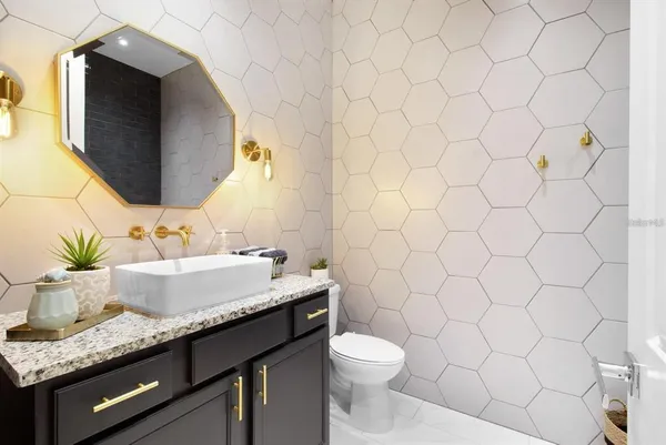 a living room with furniture flat screen tv and window