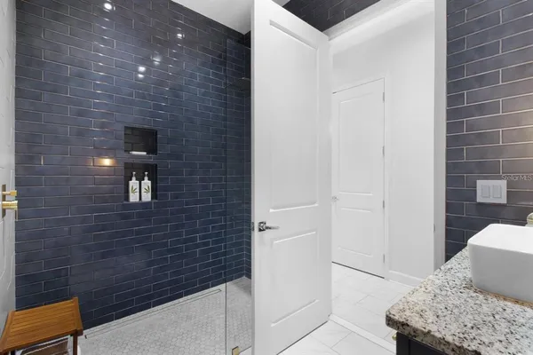 a kitchen with stainless steel appliances granite countertop a stove and a microwave