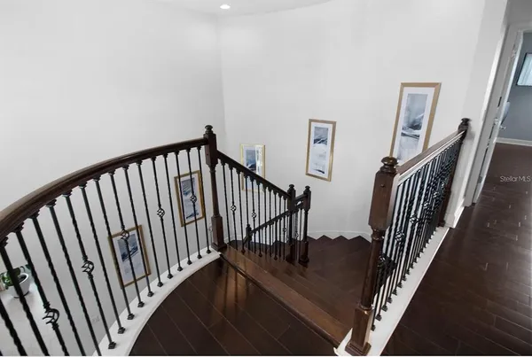 a spacious bathroom with a double vanity sink a mirror and a bathtub