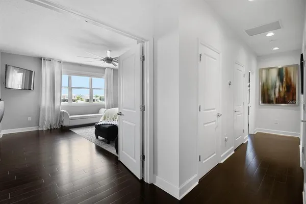 a spacious bathroom with a granite countertop sink a mirror and a shower