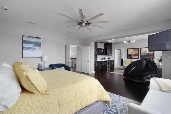 a bedroom with a bed a dresser and a window