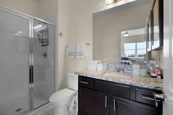 an aerial view of a house with a garden and swimming pool