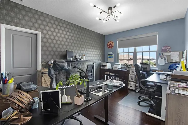 an aerial view of a house with a yard and lake view