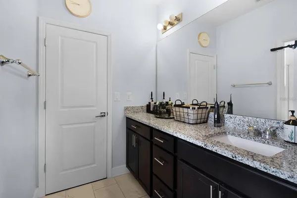 an aerial view of a house with outdoor space lake view