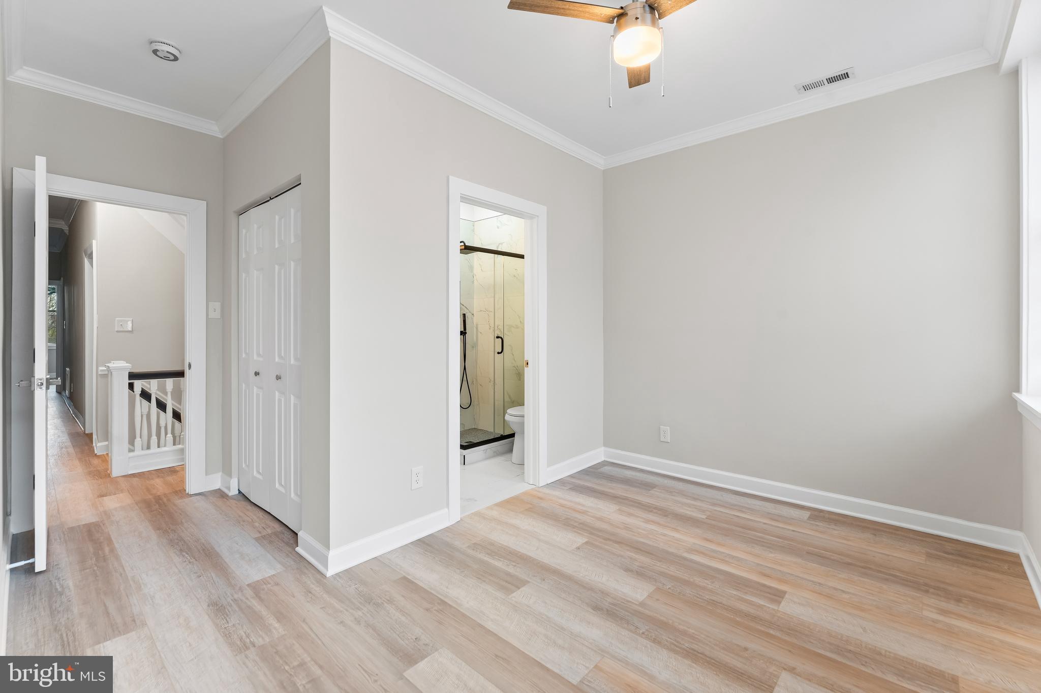 1003 West Fayette Street Baltimore, MD 21223 - Photo 20 of 59 a view of an empty room with wooden floor