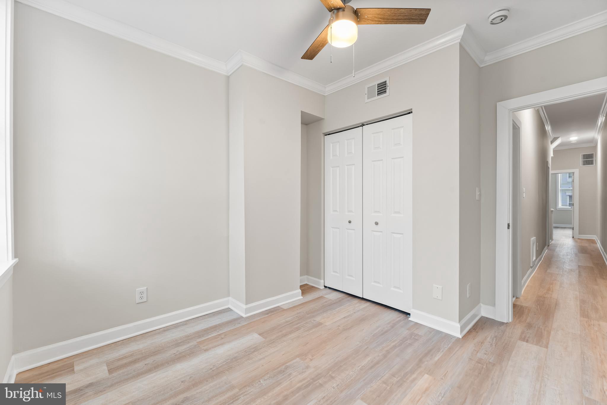 1003 West Fayette Street Baltimore, MD 21223 - Photo 30 of 59 wooden floor in an empty room