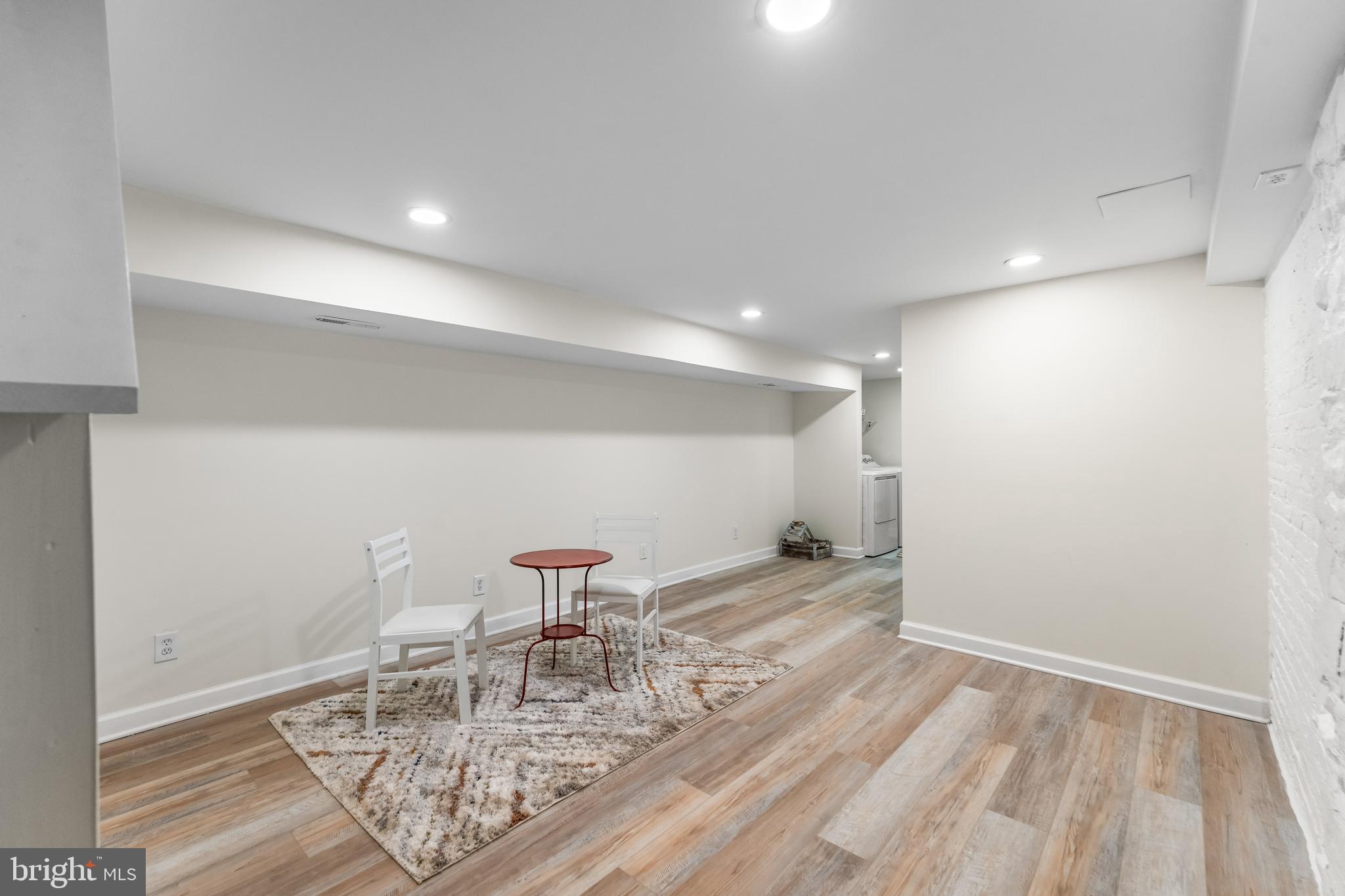 1003 West Fayette Street Baltimore, MD 21223 - Photo 47 of 59 a view of a room with a table and chairs