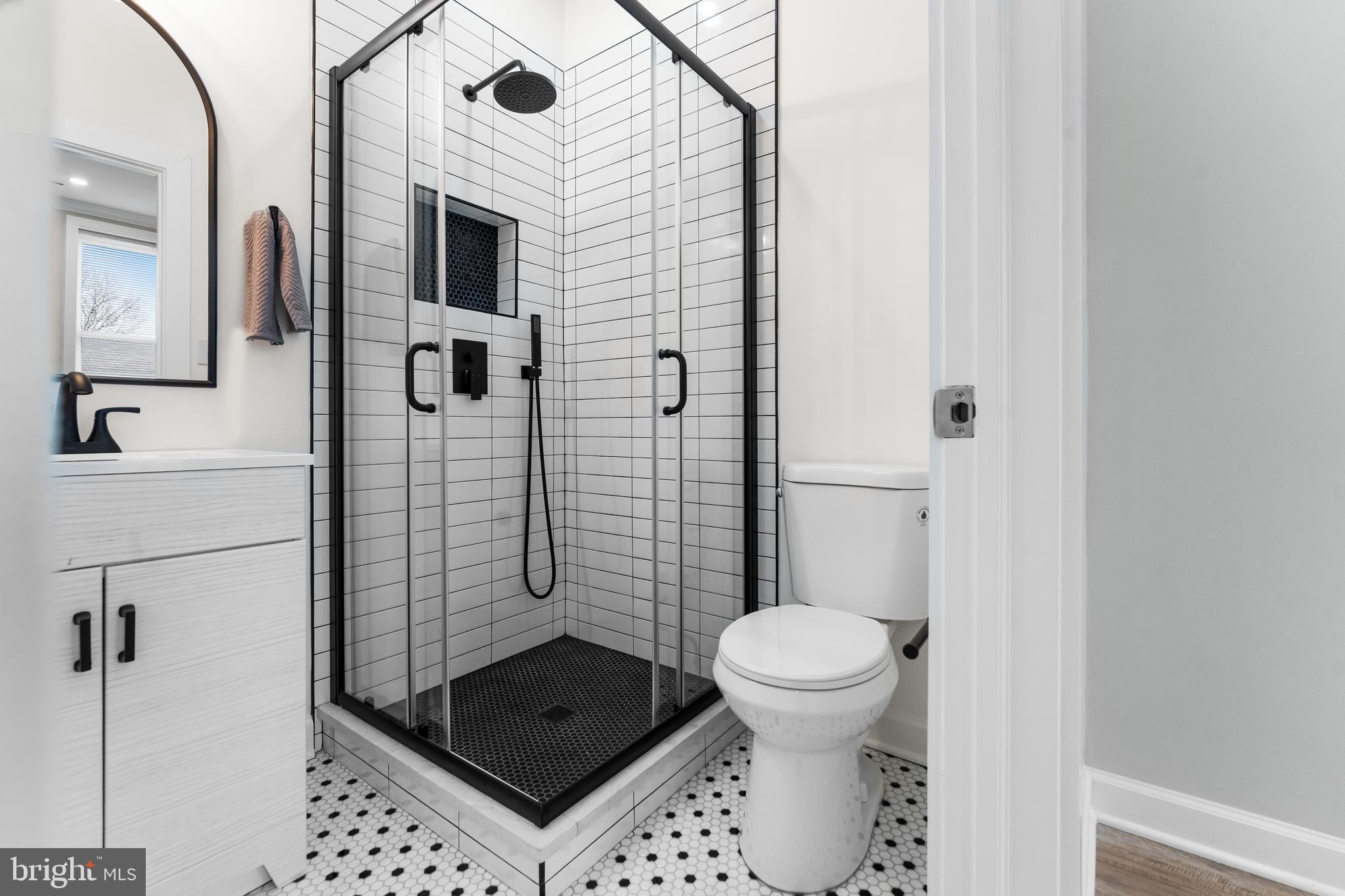 1003 West Fayette Street Baltimore, MD 21223 - Photo 51 of 59 a bathroom with a sink a toilet and shower