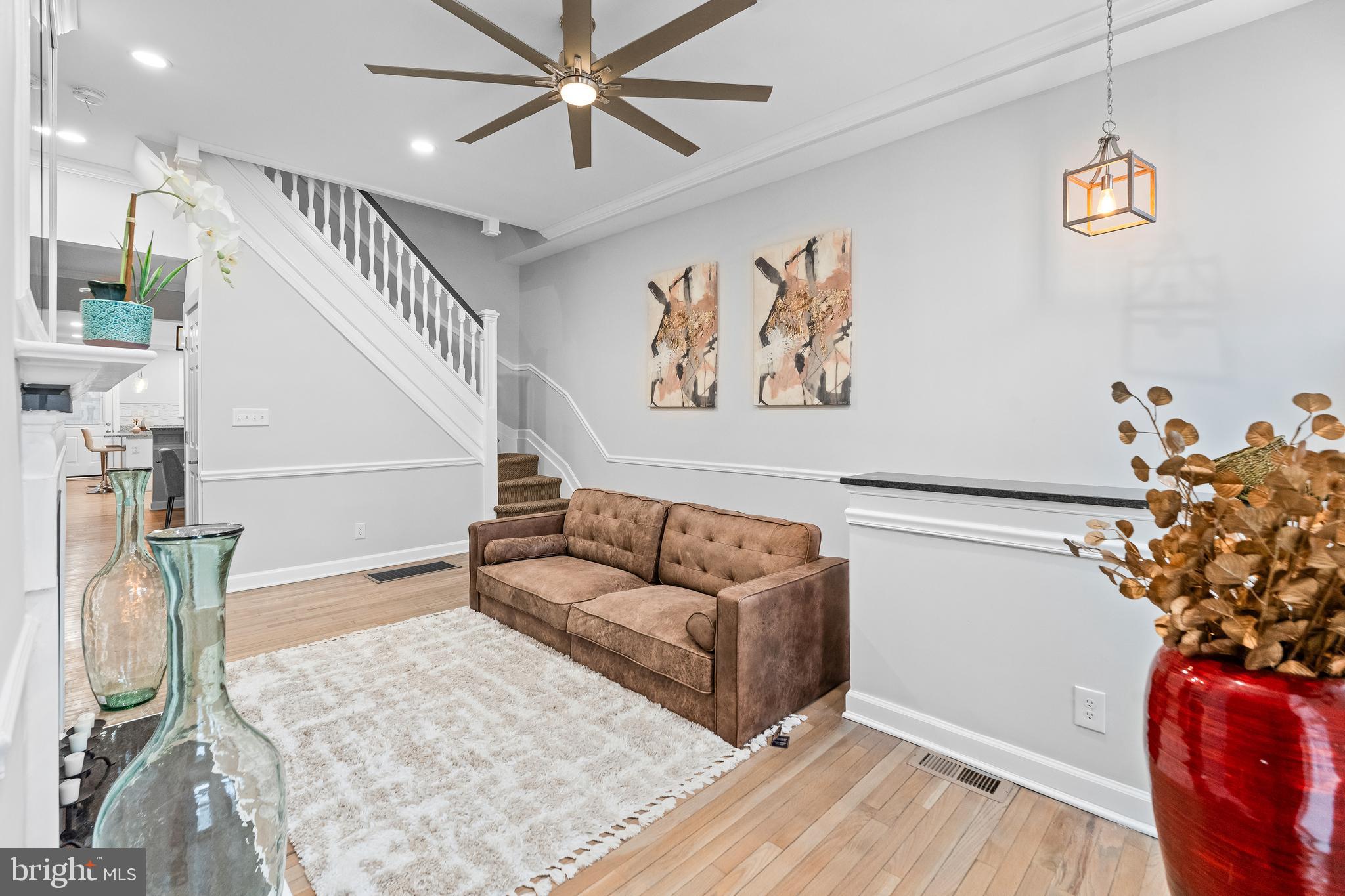 1003 West Fayette Street Baltimore, MD 21223 - Photo 6 of 59 a living room with furniture and a potted plant