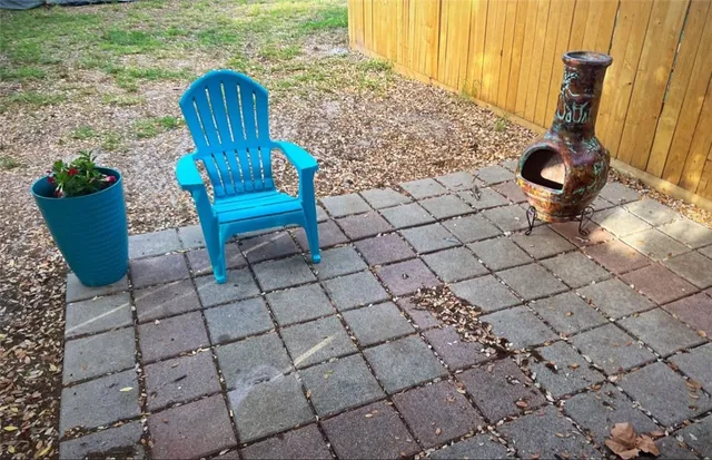a view of a backyard with sitting area