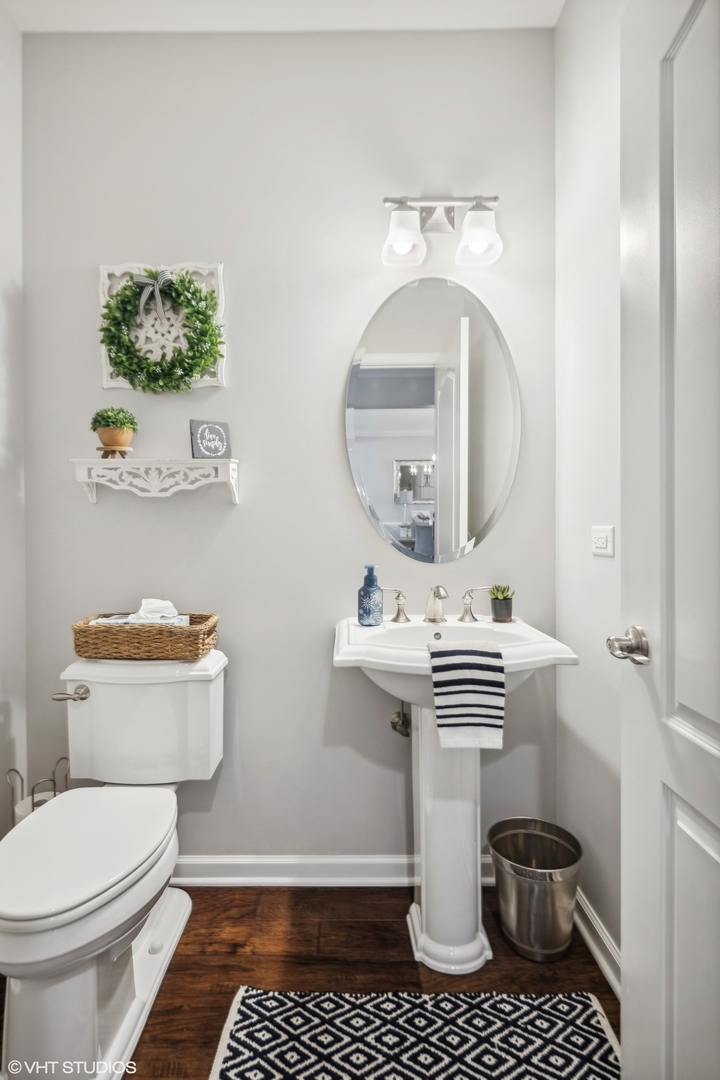 1160 Falcon Ridge Drive Elgin, IL 60124 - Photo 9 of 19 a bathroom with a sink a toilet and a mirror