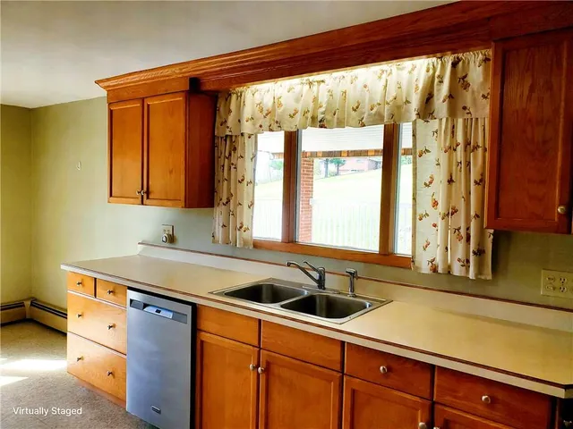 a kitchen that has a sink and a window