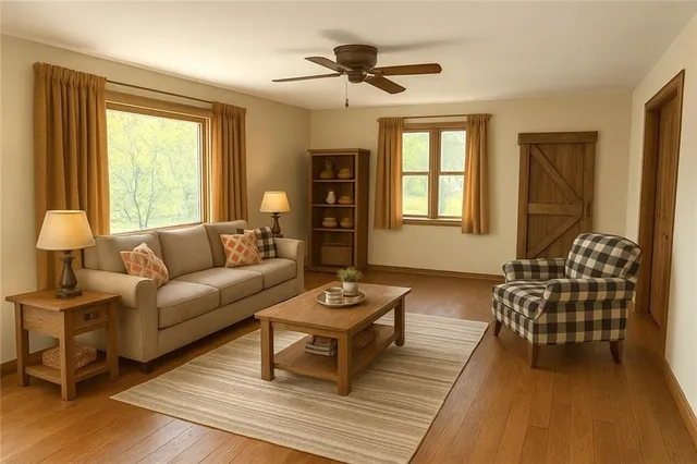 a living room with furniture and wooden floor